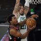 Toronto Raptors&#39; Kyle Lowry drives to the basket ahead of Boston Celtics&#39; Daniel Theis (27) during the first half of an NBA conference semifinal playoff basketball game Saturday, Sept. 5, 2020, in Lake Buena Vista, Fla. (AP Photo/Mark J. Terrill)