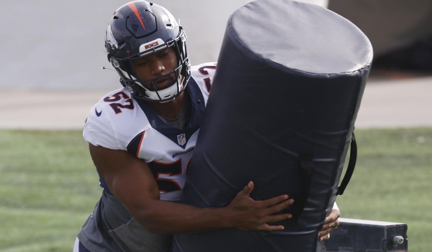 Denver Broncos linebacker Justin Hollins takes part in drills during an NFL football practice Friday, Aug. 28, 2020, in Englewood, Colo. (AP Photo/David Zalubowski)