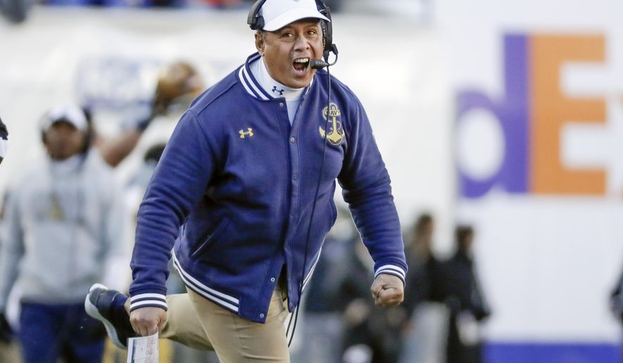 FILE - In this Dec. 31, 2019 file photo, Navy head coach Ken Niumatalolo cheers his team on in the first half of the Liberty Bowl NCAA college football game against Kansas State in Memphis, Tenn. For the first time since 1989, Navy and Brigham Young University will get together for a football game at the Naval Academy in Annapolis, Md., on Monday, Sept. 7, 2020. (AP Photo/Mark Humphrey, File)