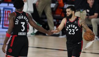 Toronto Raptors&#39; Fred VanVleet (23) celebrates with teammate OG Anunoby (3) during the second half of an NBA conference semifinal playoff basketball game against the Boston Celtics Saturday, Sept. 5, 2020, in Lake Buena Vista, Fla. (AP Photo/Mark J. Terrill)