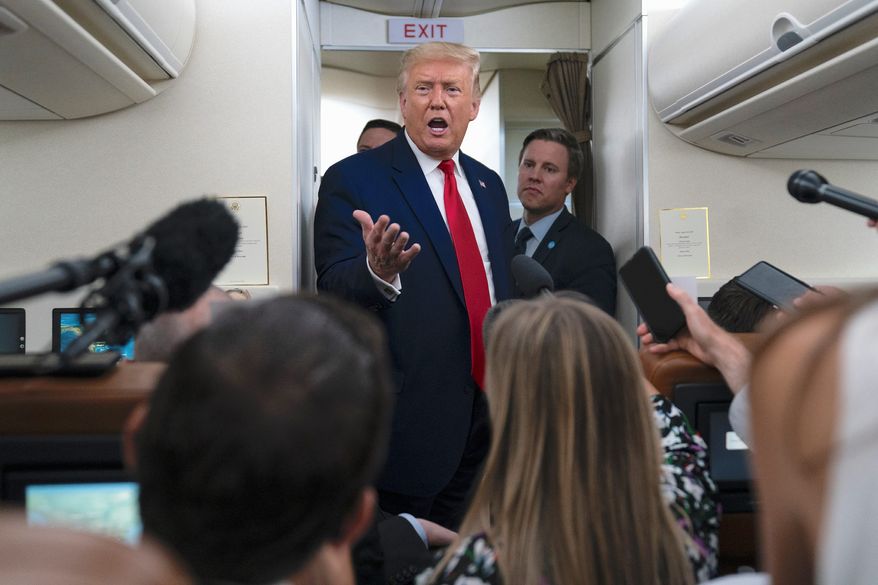 President Trump talks to reporters aboard Air Force One during a recent trip. An analysis finds that the media continues to help Joseph R. Biden by skipping evidence that Mr. Trump is &quot;on track&quot; to win the election. (Associated Press)