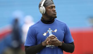 FILE - Buffalo Bills cornerback Tre&#39;Davious White warms up before an NFL football game against the New England Patriots, Sunday, Sept. 29, 2019, in Orchard Park, N.Y. White is going to have put his NHL goalie school plans on hold. Having playfully appeared in videos &amp;quot;tutoring&amp;quot; Buffalo Sabres goalies in the past, White is going to have to maintain his focus on football after signing a lucrative contract extension on Saturday, Sept. 5, 2020. (AP Photo/Adrian Kraus, File)