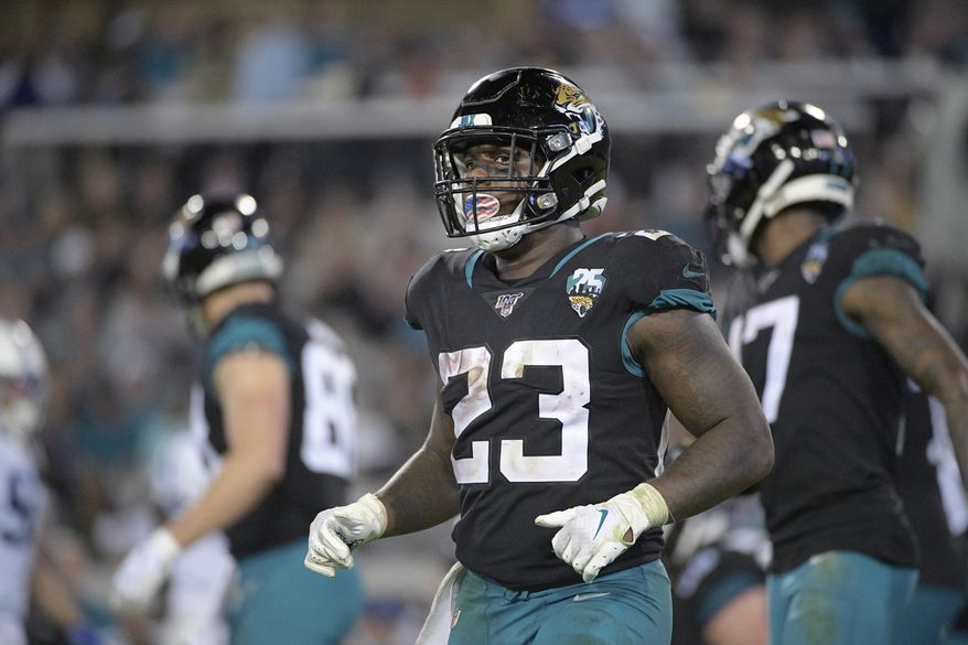 FILE - Jacksonville Jaguars running back Ryquell Armstead (23) sets up for a play during the second half of an NFL football game against the Indianapolis Colts Sunday, Dec. 29, 2019, in Jacksonville, Fla. Armstead is expected to miss significant time after landing on the COVID-19 list for the second time in five weeks. Coach Doug Marrone says Armstead will be sidelined "a while.” “I can't put a real timetable on it, but he'll be out for a while," Marrone said Monday, Sept. 7, 2020.(AP Photo/Phelan M. Ebenhack, File)