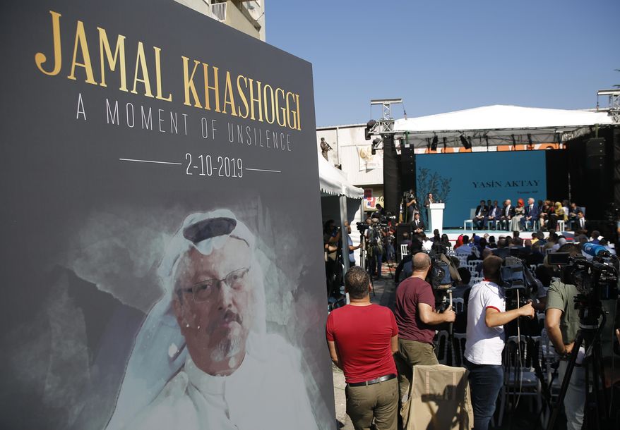 In this Oct. 2, 2019, file photo, a picture of slain Saudi journalist Jamal Kashoggi is displayed during a ceremony near the Saudi Arabia consulate in Istanbul, marking the one-year anniversary of his death. (AP Photo/Lefteris Pitarakis, File)