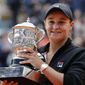 FILE - In this June 8, 2019, file photo, Australia&#39;s Ash Barty holds the trophy after winning the women&#39;s final match of the French Open tennis tournament at the Roland Garros stadium in Paris. Top-ranked Ash Barty will not defend her French Open title because of concerns over traveling during the COVID-19 pandemic. (AP Photo/Christophe Ena, File)