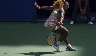 Serena Williams, of the United States, returns a shot to Maria Sakkari, of Greece, during the quarterfinals of the US Open tennis championships, Monday, Sept. 7, 2020, in New York. (AP Photo/Seth Wenig)