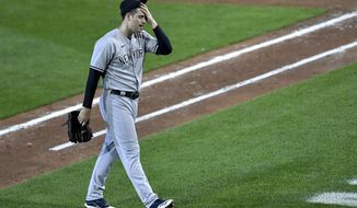 New York Yankees pitcher Adam Ottavino walks to the dugout after being pulled during the sixth inning of a baseball game against the Toronto Blue Jays in Buffalo, N.Y., Monday, Sept. 7, 2020. (AP Photo/Adrian Kraus)