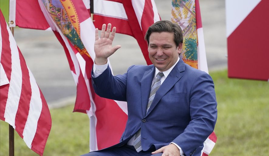 Florida Gov. Ron DeSantis attends an event with President Donald Trump on the environment at the Jupiter Inlet Lighthouse and Museum, Tuesday, Sept. 8, 2020, in Jupiter, Fla. (AP Photo/John Raoux)