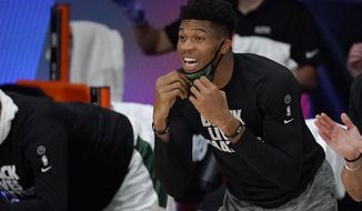 Milwaukee Bucks&#39; Giannis Antetokounmpo shouts from the bench in the second half of an NBA conference semifinal playoff basketball game against the Miami Heat Tuesday, Sept. 8, 2020 in Lake Buena Vista, Fla. (AP Photo/Mark J. Terrill)