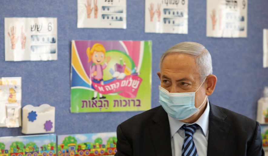 Israeli Prime Minister Benjamin Netanyahu attends a ceremony to mark the opening of the school year, at the Netaim School in the West Bank settlement of Mevo Horon, Tuesday, Sept. 1, 2020. (Marc Israel Sellem/Pool via AP)