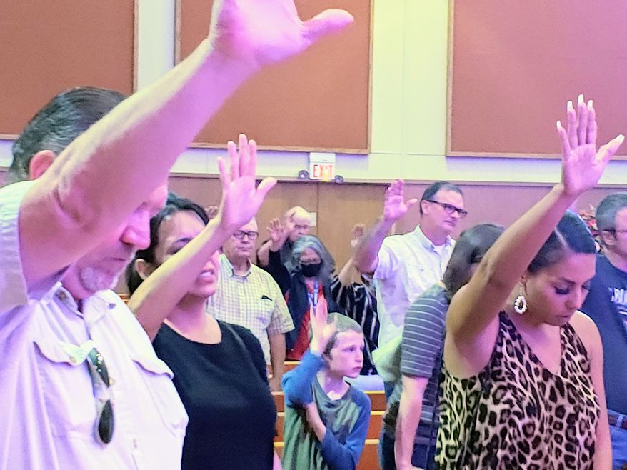 Attendees pray at Sept. 5, 2020, meeting on "sanctuary cities for the unborn" at the Church of the Blessed International in Lubbock, Texas. (Photo courtesy of Mark Lee Dickson)