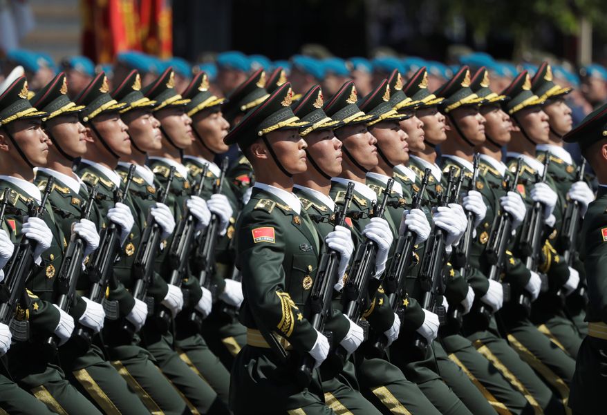 China is building up its People's Liberation Army and stepping up provocations and military coercion in Asia, including against pro-democracy protesters in Hong Kong. "Gray zone" warfare below the level of armed clashes is seen as as part of Beijing's strategy to increase its power and influence throughout the region. (Associated Press/File)