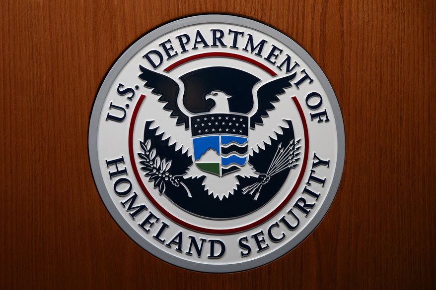 In this June 28, 2019, file photo the Department of Homeland Security (DHS) seal is seen during a news conference in Washington. (AP Photo/Carolyn Kaster, File)  **FILE**