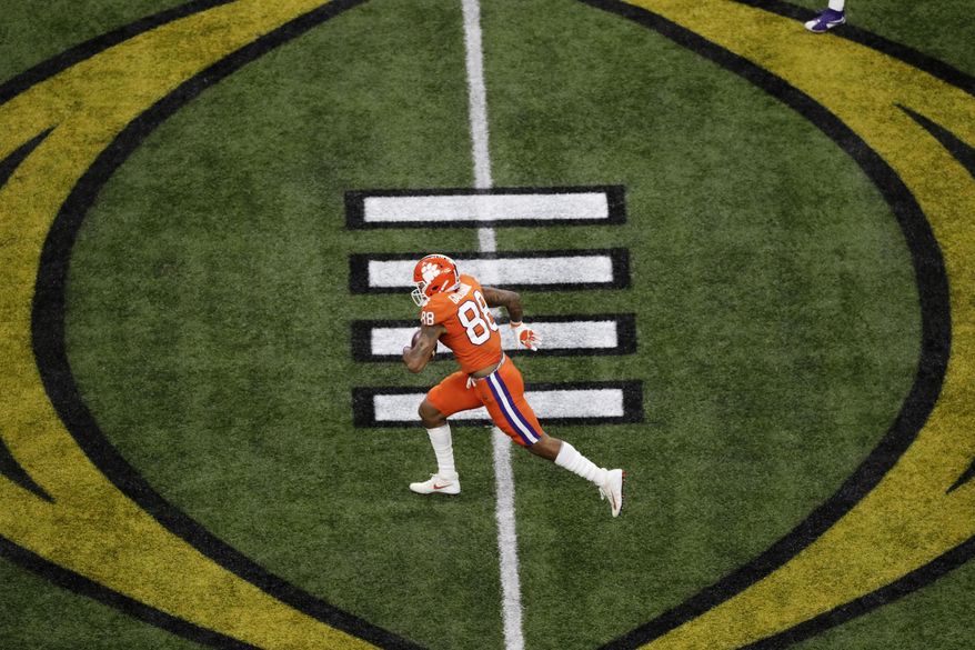 FILE - Clemson tight end Braden Galloway runs against LSU during the first half of the NCAA College Football Playoff national championship game Monday, Jan. 13, 2020, in New Orleans. Galloway is seeing shorter lines at fast-food restaurants and fewer people around campus after Clemson started the fall semester with online-only undergraduate classes amid the coronavirus pandemic. (AP Photo/Eric Gay, File)