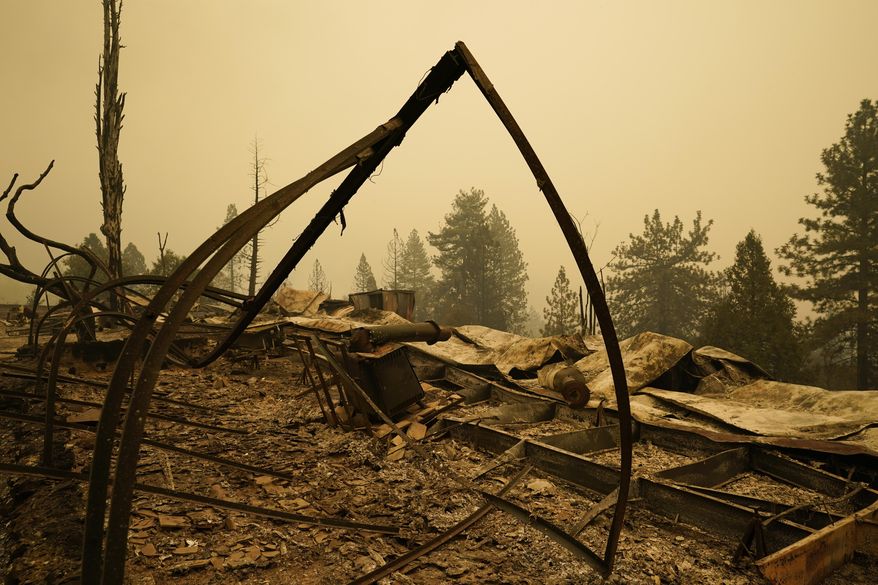 Property is left in ruins after the Creek Fire passed through Tuesday, Sept. 8, 2020, in Tollhouse, Calif. (AP Photo/Marcio Jose Sanchez)