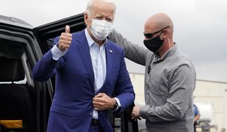 Democratic presidential candidate former Vice President Joe Biden arrives to board a plane at New Castle Airport in New Castle, Del., Wednesday, Sept. 9, 2020, en route to campaign events in Michigan. (AP Photo/Patrick Semansky)