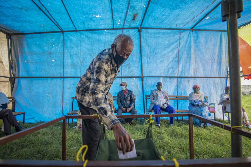 Residents cast their votes in a local election in the regional capital Mekelle, in the Tigray region of Ethiopia Wednesday, Sept. 9, 2020. People began voting in Ethiopia's northern Tigray region on Wednesday in a local election defying the federal government and increasing political tensions in Africa's second most populous country. (AP Photo)