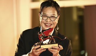 Director Ann Hui holds her Golden Lion award for Lifetime Achievement during the 77th edition of the Venice Film Festival in Venice, Italy, Tuesday, Sept. 8, 2020. (Photo by Joel C Ryan/Invision/AP)