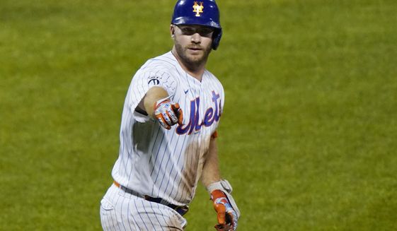 New York Mets designated hitter Pete Alonso (20) points to the dugout after hitting a solo home run during the eighth inning of the team&#x27;s baseball game against the Baltimore Orioles, Wednesday, Sept. 9, 2020, in New York. (AP Photo/Kathy Willens)