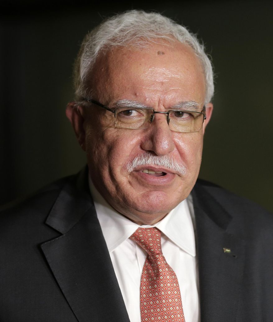 FILE - In this Sept. 26, 2018, file photo, Palestinian minister of foreign affairs Riyad al-Maliki speaks to reporters following a meeting in New York. The Palestinian foreign minister Wednesday, Sept. 9, 2020, called on Arab states to dismiss a deal between the United Arab Emirates and Israel to normalize relations, describing the agreement scheduled to be finalized next week as “an earthquake.” The UAE and Israel announced the deal to establish full diplomatic relations on Aug. 13. (AP Photo/Seth Wenig, File)
