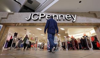 FILE - In this Nov. 24, 2017, file photo, a shopper heads into a J.C. Penney store in Seattle. Mall owners Simon Property Group and Brookfield Property Partners are close to a deal to buy department store chain J.C. Penney out of bankruptcy and keep the chain running, an attorney for Penney&#39;s announced Wednesday, Sept. 9, 2020. (AP Photo/Elaine Thompson, File)