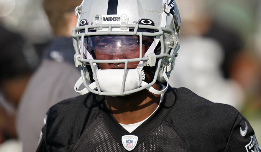 FILE - Las Vegas Raiders wide receiver Henry Ruggs III attends an NFL football training camp practice Thursday, Aug. 13, 2020, in Henderson, Nev. The Raiders play the Carolina Panthers on Sunday, Sept. 13. (AP Photo/John Locher, Pool, File)