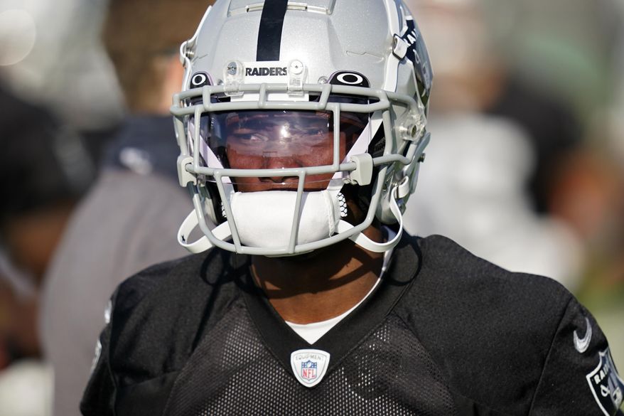 FILE - Las Vegas Raiders wide receiver Henry Ruggs III attends an NFL football training camp practice Thursday, Aug. 13, 2020, in Henderson, Nev. The Raiders play the Carolina Panthers on Sunday, Sept. 13. (AP Photo/John Locher, Pool, File)