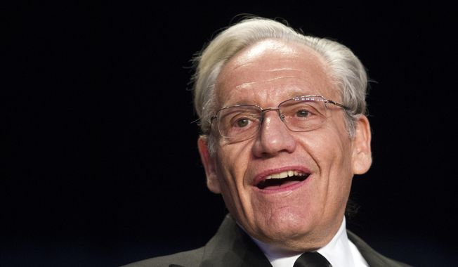 FILE - In this April 29, 2017, file photo journalist Bob Woodward sits at the head table during the White House Correspondents&#x27; Dinner in Washington. Woodward, facing widespread criticism for only now revealing President Donald Trump&#x27;s early concerns about the severity of the coronavirus, told The Associated Press that he needed time to be sure that Trump&#x27;s private comments from February were accurate. (AP Photo/Cliff Owen, File)