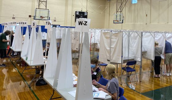 In this Tuesday, Sept. 8, 2020, photograph, voters cast their ballots in Exeter, N.H., in the state primary election. (Alexander LaCasse/SeacoastOnline.com/Portsmouth Herald via AP)  ** FILE **