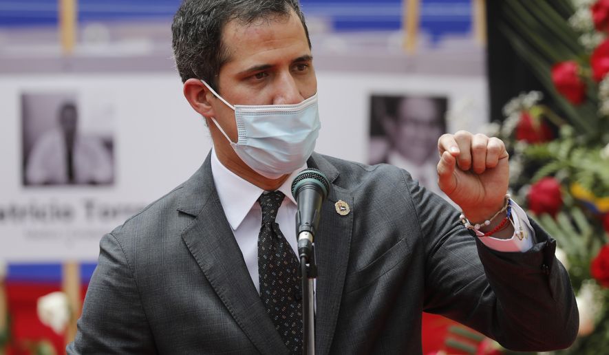 Opposition leader Juan Guaido speaks during an event by health workers to honor their colleagues who have died of COVID-19 in Caracas, Venezuela, Thursday, Sept. 10, 2020. (AP Photo/Ariana Cubillos)