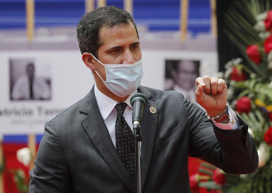 Opposition leader Juan Guaido speaks during an event by health workers to honor their colleagues who have died of COVID-19 in Caracas, Venezuela, Thursday, Sept. 10, 2020. (AP Photo/Ariana Cubillos)