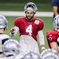 Dallas Cowboys quarterback Dak Prescott (4) gives instructions to his teammates during an NFL football training camp practice at The Star, Friday, Aug. 28, 2020, in Frisco, Texas. (AP Photo/Brandon Wade)