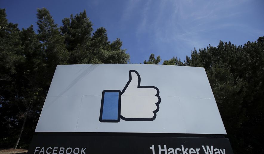 FILE - In this April 14, 2020 file photo, the thumbs up Like logo is shown on a sign at Facebook headquarters in Menlo Park, Calif. Facebook may be forced to stop sending data about its European users to the U.S., in the first major fallout from a recent court ruling that found some trans-Atlantic data transfers don't protect users from American government snooping. The social network said Wednesday, Sept. 9, 2020 that Ireland's Data Protection Commission has started an inquiry into how Facebook shifts data from the European Union to the United States. (AP Photo/Jeff Chiu, File)
