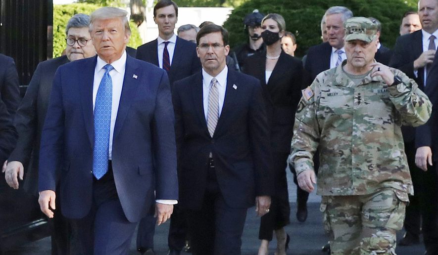 In this June 1, 2020, file photo, President Donald Trump departs the White House to visit outside St. John&#39;s Church, in Washington. Walking behind Trump from left are, Attorney General William Barr, Secretary of Defense Mark Esper and Gen. Mark Milley, chairman of the Joint Chiefs of Staff. (AP Photo/Patrick Semansky, File)