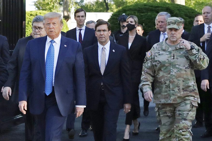 In this June 1, 2020, file photo, President Donald Trump departs the White House to visit outside St. John&#39;s Church, in Washington. Walking behind Trump from left are, Attorney General William Barr, Secretary of Defense Mark Esper and Gen. Mark Milley, chairman of the Joint Chiefs of Staff. (AP Photo/Patrick Semansky, File)