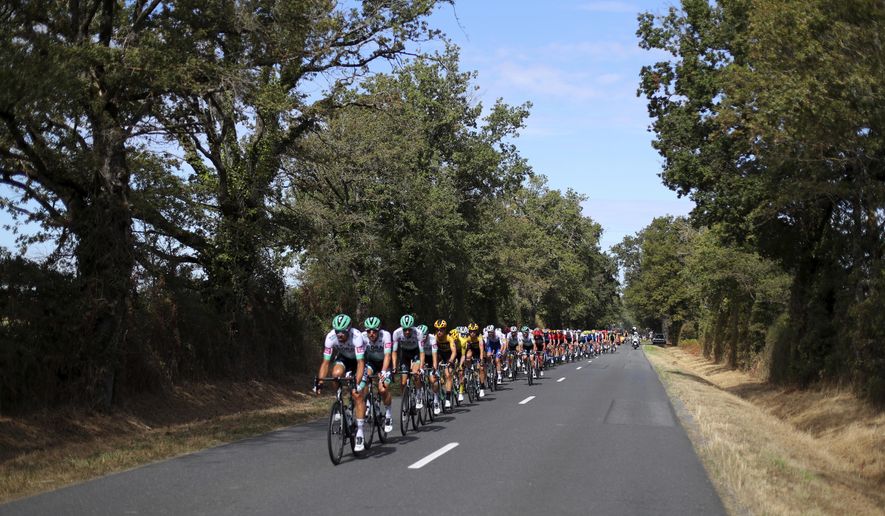 The pack rides during the stage 12 of the Tour de France cycling race over 218 kilometers from Chauvigny to Sarran, Thursday, Sept. 10, 2020. (AP Photo/Thibault Camus)
