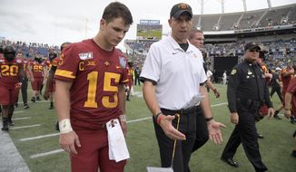 FILE - Iowa State head coach Matt Campbell, center, walks off the field with quarterback Brock Purdy after the Camping World Bowl NCAA college football game against Notre Dame Saturday, Dec. 28, 2019, in Orlando, Fla. Iowa State enters this season off its second-best three-year stretch in program history and with its sights set on doing something it&#x27;s never done — make the Big 12 championship game. (AP Photo/Phelan M. Ebenhack, File)