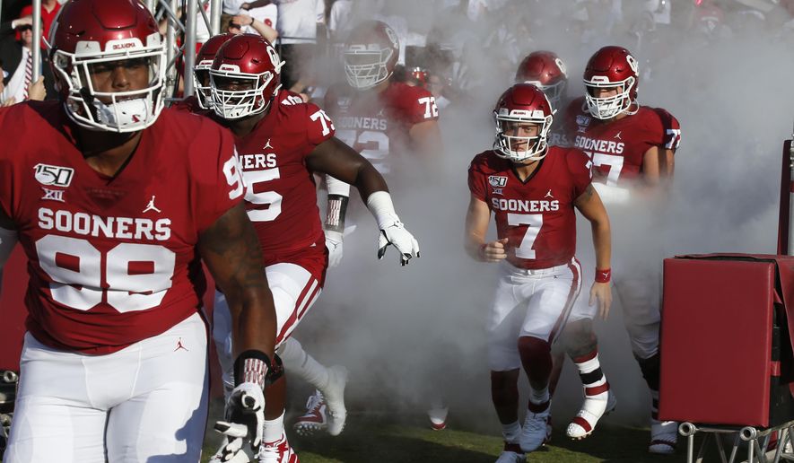 FILE - Oklahoma quarterback Spencer Rattler (7) runs onto the field before an NCAA college football game against South Dakota Saturday, Sept. 7, 2019, in Norman, Okla. Rattler, a redshirt freshman, has been named Oklahoma’s starting quarterback. Missouri State plays at No. 5 Oklahoma on Saturday, Sept. 12, 2020. (AP Photo/Sue Ogrocki, File)