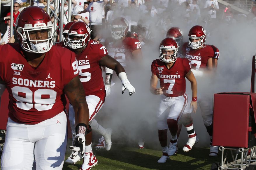 FILE - Oklahoma quarterback Spencer Rattler (7) runs onto the field before an NCAA college football game against South Dakota Saturday, Sept. 7, 2019, in Norman, Okla. Rattler, a redshirt freshman, has been named Oklahoma’s starting quarterback. Missouri State plays at No. 5 Oklahoma on Saturday, Sept. 12, 2020. (AP Photo/Sue Ogrocki, File)