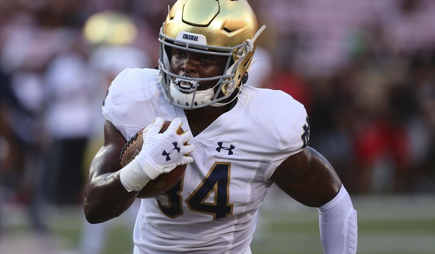 FILE - Notre Dame Jahmir Smith runs during an NCAA football game on Monday, Sept. 2 , 2019, in Louisville, Ky. With all the success Notre Dame has enjoyed its last three seasons, amassing a 33-6 record under coach Brian Kelly, it has been the inability to run the football successfully in big games that has curtailed the championship hopes of the Fighting Irish. No. 10 Notre Dame hopes to change that starting Saturday when Duke visits for the 2020 season opener. (AP Photo/Tony Tribble, File)
