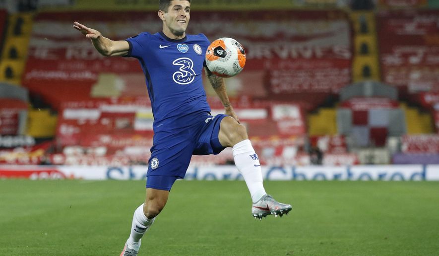 FILE - In this Wednesday, July 22, 2020 file photo, Chelsea's Christian Pulisic controls the ball during the English Premier League soccer match between Liverpool and Chelsea at Anfield Stadium in Liverpool, England. Frank Lampard’s squad has certainly seen the most intriguing changes ahead of the new campaign - having been banned from signing players last summer, they have looked to make up for lost time and recruited some big names to replace long-term servants such as Pedro and Willian. (Phil Noble/Pool via AP, file)