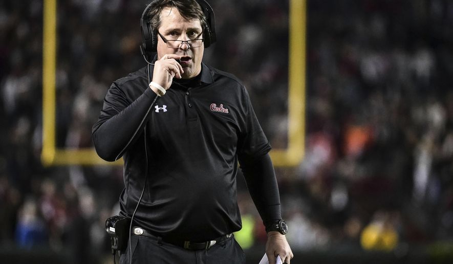 FILE - In this Nov. 2, 2019, file photo, South Carolina head coach Will Muschamp walks on the sideline during the second half of an NCAA college football game in Columbia, S.C. Muschamp haven&#39;t had a true quarterback competition since 2016 _ and he&#39;s taking much of the way through camp as Ryan Hilinski, Collin Hill and Luke Doty try to become the Gamecocks&#39; passer. (AP Photo/Sean Rayford, File)