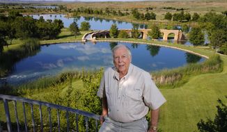 FILE - In this May 30, 2017, file photo, oil tycoon T. Boone Pickens poses for a photo on his Mesa Vista Ranch in the panhandle of Texas. Works of art depicting the American West and other items collected by the late Texas oil tycoon T. Boone Pickens are expected to sell for more than $15 million at an auction. Christie&#39;s announced Thursday, Sept. 10, 2020 that the auction will be held Oct. 28 in New York. (Tom Fox/The Dallas Morning News via AP, File)