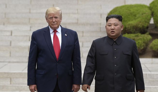 FILE - In this June 30, 2019, file photo, President Donald Trump, left, meets with North Korean leader Kim Jong Un at the North Korean side of the border at the village of Panmunjom in Demilitarized Zone. Journalist Bob Woodward’s book “Rage,&amp;quot; includes new details about the president’s comments on Kim Jong Un, racial unrest and a mysterious new weapon that Trump says other world powers don’t know about. (AP Photo/Susan Walsh, File)