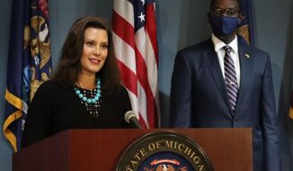 In this photo provided by the Michigan Office of the Governor, Gov. Gretchen Whitmer addresses the state during a speech in Lansing, Mich., Thursday, Sept. 10, 2020. Whitmer on Thursday sharply criticized President Donald Trump following revelations that he had purposely downpla yed the deadly coronavirus, calling it &amp;quot;devastating&amp;quot; news and Trump the &amp;quot;biggest threat&amp;quot; to Americans.(Michigan Office of the Governor via AP)