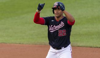 Washington Nationals Juan Soto gestures after hitting a two-run double during the first inning of the team&#39;s baseball game against the Atlanta Braves in Washington, Friday, Sept. 11, 2020. (AP Photo/Manuel Balce Ceneta)
