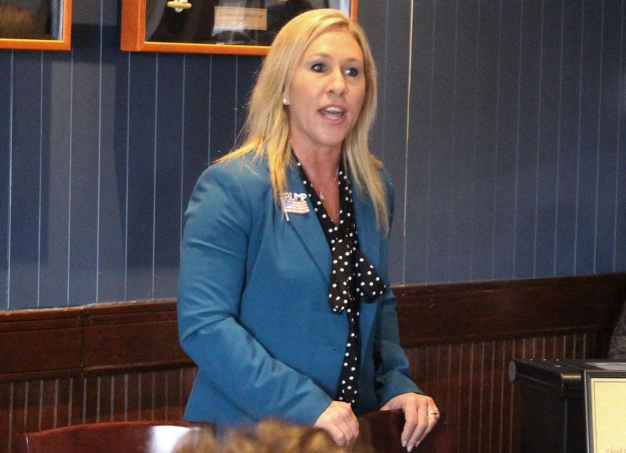 FILE - In this March 3, 2020, file photo, Republican Marjorie Taylor Greene speaks to a GOP women's group in Rome, Ga. The Democratic candidate running against Republican Marjorie Taylor Greene, who has expressed support for the QAnon conspiracy theory and been criticized for other incendiary comments, is dropping out of their race for a U.S. House seat representing northwest Georgia. Democrat Kevin Van Ausdal bowed out of the race on Friday, Sept. 11, 2020. (John Bailey/The Rome News-Tribune via AP, File)