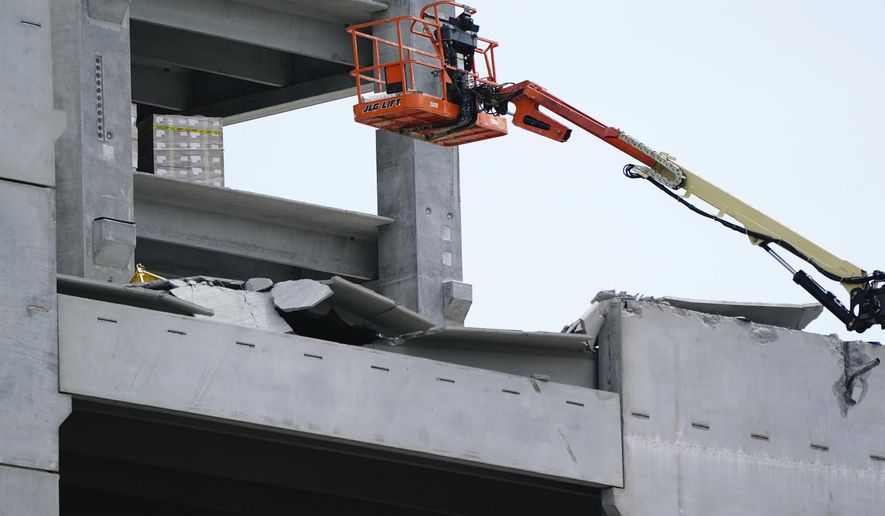Damage is seen to a parking deck under construction after it partially collapsed, injuring several workers, on Friday, Sept. 11, 2020, in Atlanta. (AP Photo/Elijah Nouvelage)