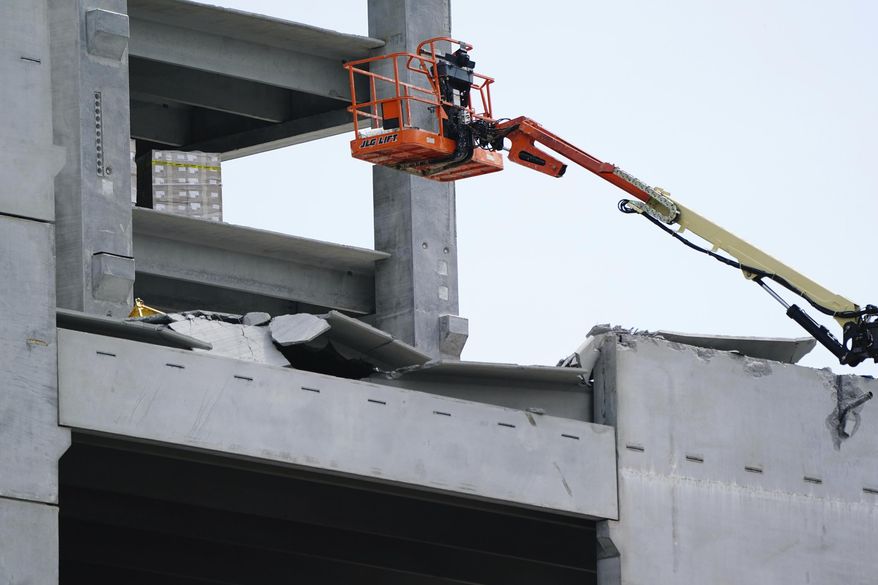 Damage is seen to a parking deck under construction after it partially collapsed, injuring several workers, on Friday, Sept. 11, 2020, in Atlanta. (AP Photo/Elijah Nouvelage)