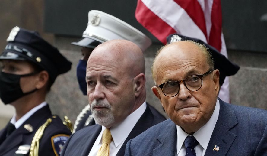 In this file photo, former New York Mayor Rudolph Giuliani, right, is accompanied by Bernard Kerik, former New York City police Commissioner, attending the Tunnel to Towers ceremony, Sept. 11, 2020, in New York.  Mr. Kerik has turned over a batch of documents to the House committee investigating the Jan. 6 attack on the Capitol, while withholding several pending an agreement over Mr. Kerik’s deposition. (AP Photo/Mark Lennihan)  **FILE**